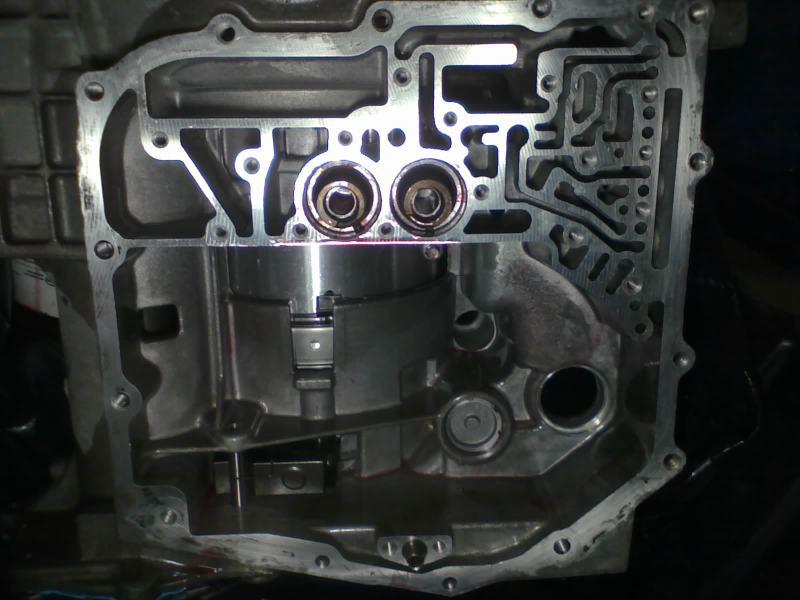 Underdrive & overdrive pistons go in with their springs facing the valve body. Low/reverse piston goes in springs-first, and is retained with its cap and snap-ring.